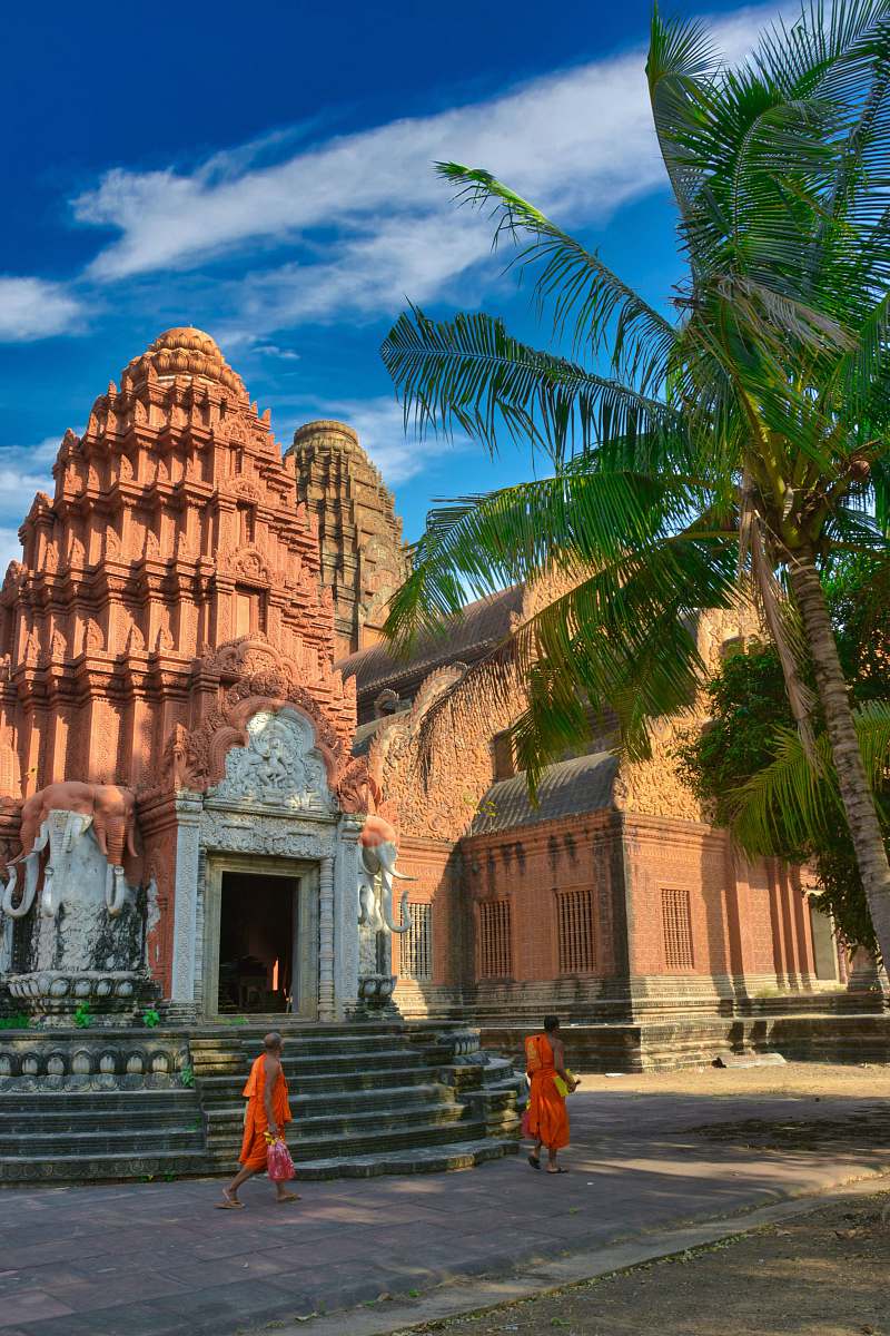 phnom reap monastery people walking near brown concrete building during daytime phnom penh